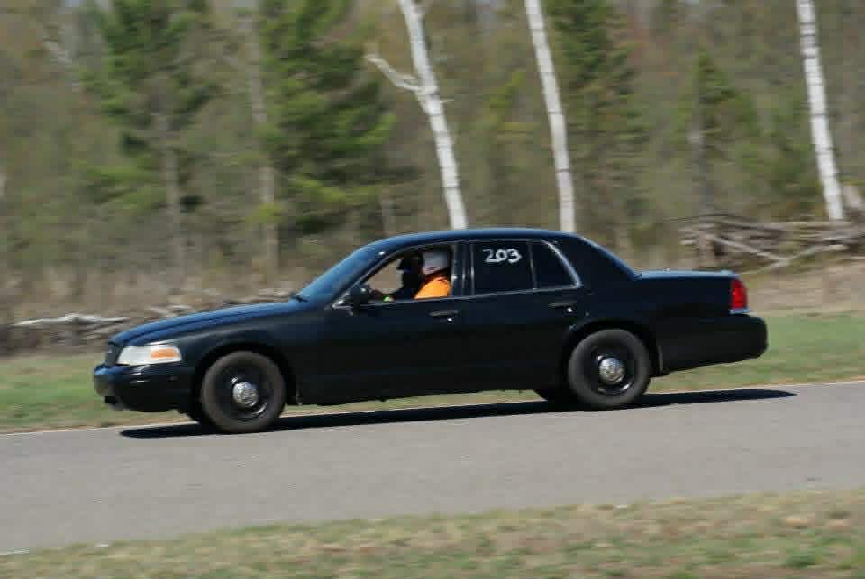 Chris racing his black Crown Victoria